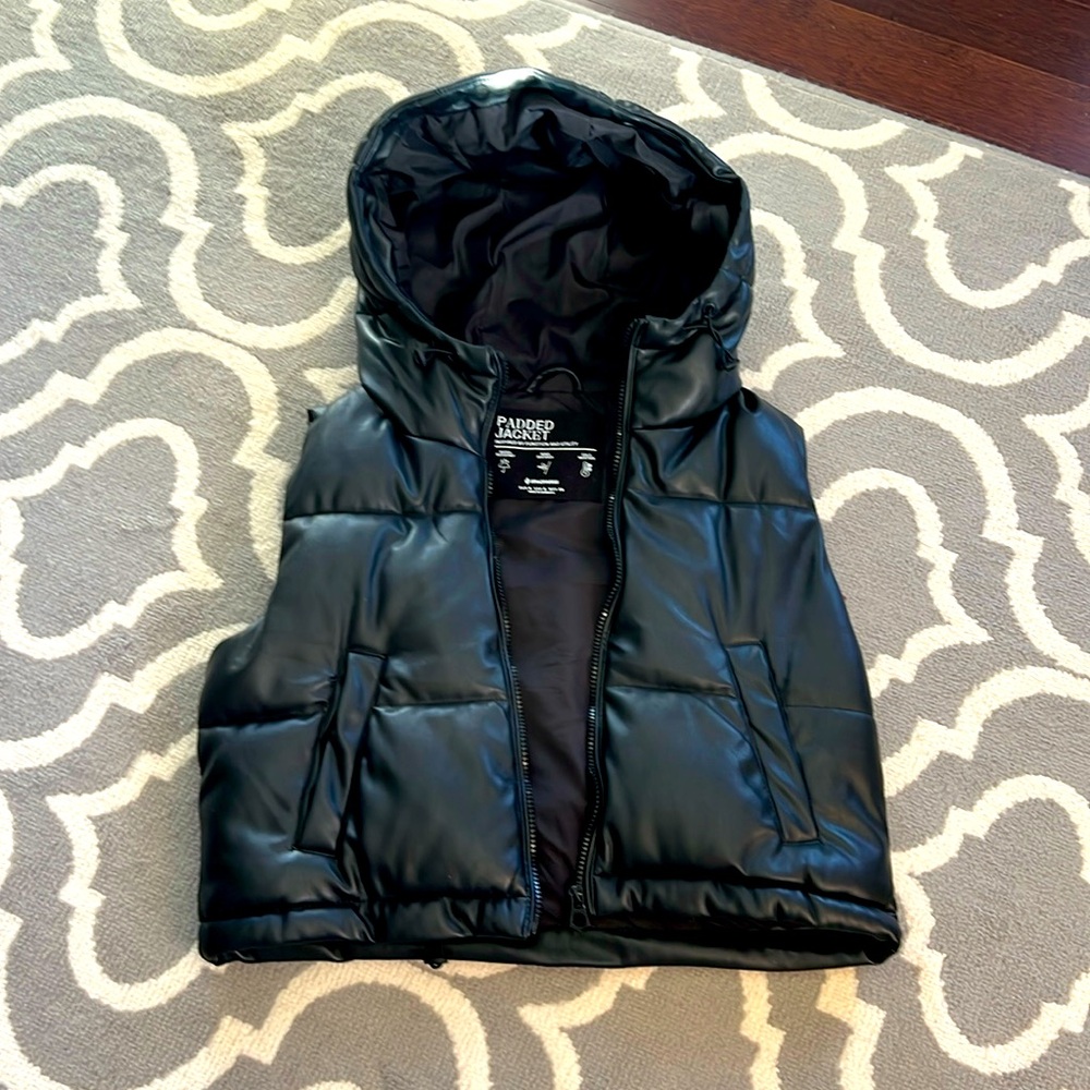 NWOT faux leather hooded vest.